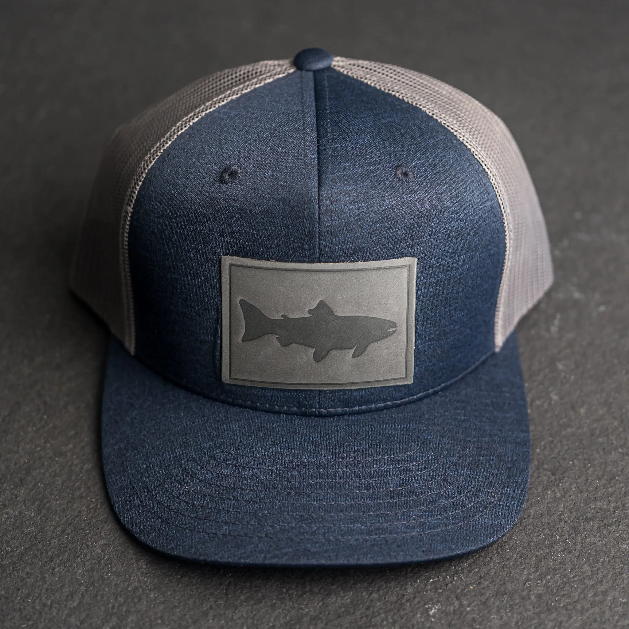 Leather Patch Performance Style Trucker Hat - Fish Stamp